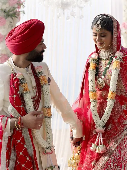 We capture the solemnity and beauty of diverse wedding traditions, like this moment from a Sikh ceremony. Our focus is on the meaningful interactions and rituals that define your union, ensuring every cultural detail is respected and beautifully documented.