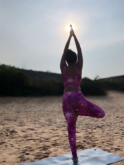 Finding balance where the ocean meets the shore. A silhouette of Tree Pose against the setting sun is a reminder that we too can shine our own light.
