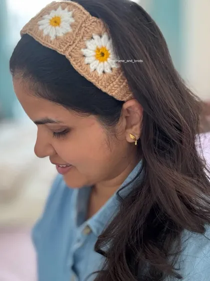 Here is my crochet daisy headband being worn. I designed it to be soft, comfortable, and add a lovely handmade touch to any outfit. The granny square design is timeless and I use 100% cotton yarn.