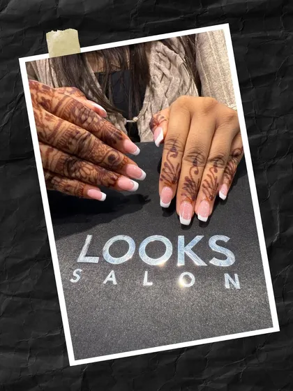 A beautiful combination for a bride or wedding guest. This classic French manicure on squared nails looks stunning alongside traditional henna, creating a perfect blend of modern and cultural styles.