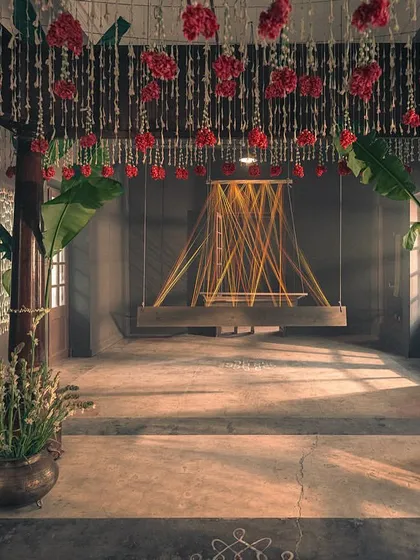 The empty mandap, set for the ceremony. The swing and the thread installation symbolize the loom, connecting the bride's journey back to the weaver's craft.