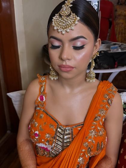 A close-up of Bhagyashree's Haldi makeup. The soft cut-crease with shimmery eyeshadow and winged liner gives her a fresh and youthful glow for the ceremony.