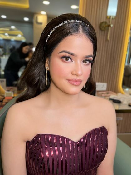 This doll is ready for a party in her beautiful maroon gown. We gave her a soft, glamorous look to match.