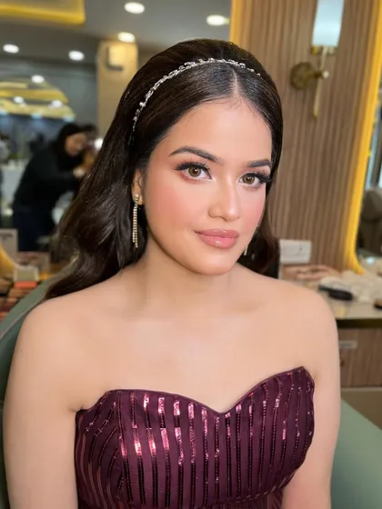 This doll is ready for a party in her beautiful maroon gown. We gave her a soft, glamorous look to match.