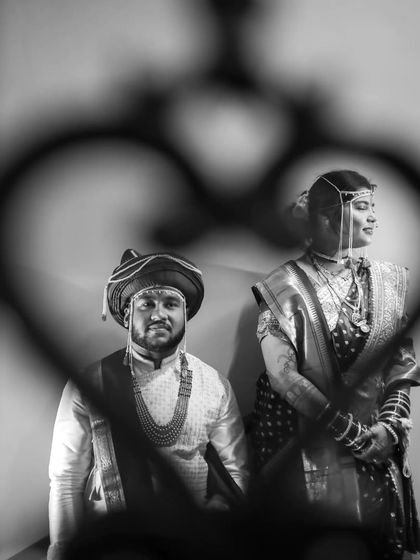 A creative black and white shot, framing the couple within a heart shape. I love finding unique perspectives to make your wedding photos stand out.