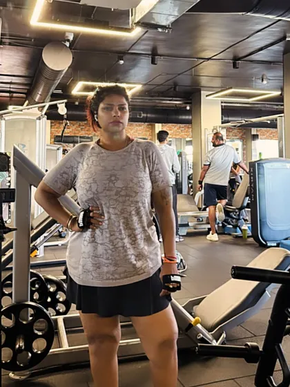 This image captures a moment of readiness between sets. Each workout is a mix of different exercises and poses to keep the body challenged and the mind engaged.