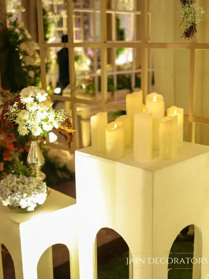 Soft candlelight creates a romantic and serene ambiance. I used a collection of flameless pillar candles and small floral bouquets to style this corner, adding a gentle glow to the evening.