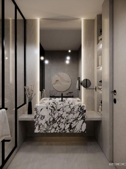 The washroom in the Meraki project embraces minimalism with a touch of luxury. A striking vessel sink carved from a single piece of exotic marble becomes the room's focal point, set against a backdrop of clean lines and soft, integrated lighting.