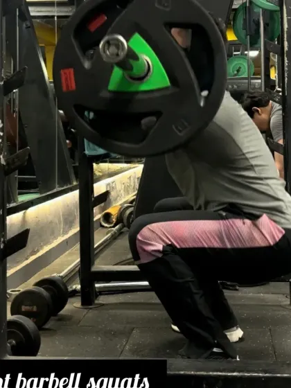 Day 27: Performing front barbell squats to build strength and muscle in the quads and glutes.