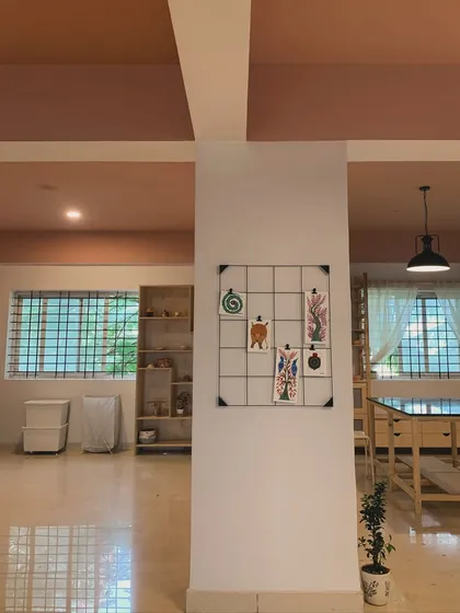 Another view of our spacious studio, showing the layout and the natural light that fills the room. We believe a beautiful space inspires beautiful work.