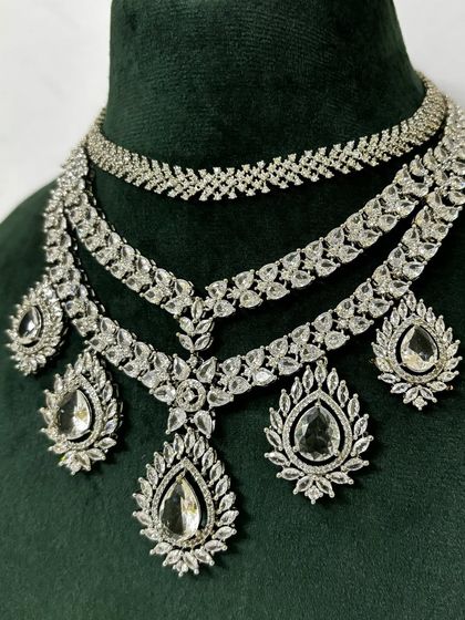 A close-up of the layered American diamond set, showing the different pendant designs. This rental piece is full of intricate details.