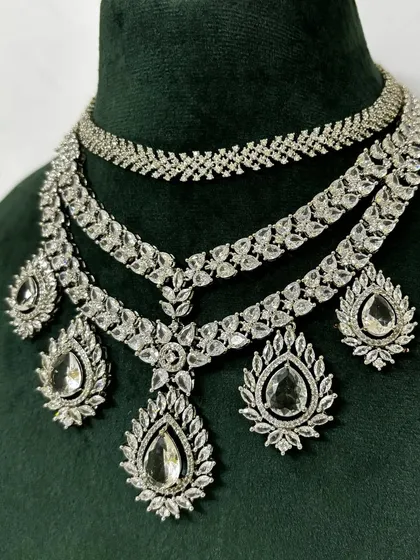 A close-up of the layered American diamond set, showing the different pendant designs. This rental piece is full of intricate details.