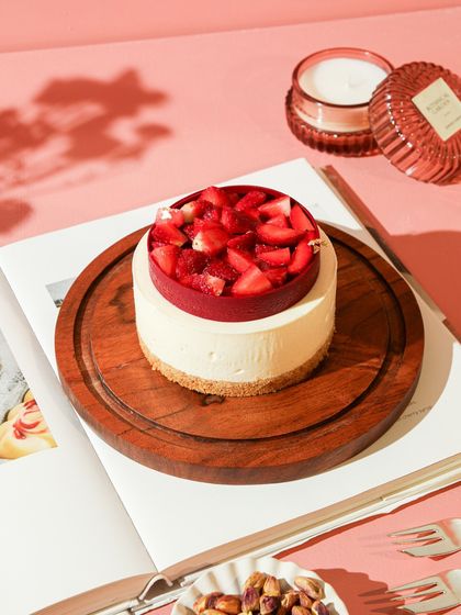 Our signature Strawberry Cheesecake, a perfect winter indulgence, beautifully captured for our seasonal menu.