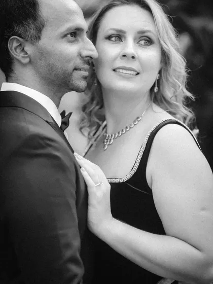 A candid black and white portrait where the couple is looking away from the camera. This creates a sense of a stolen, natural moment during their elegant pre-wedding photoshoot.