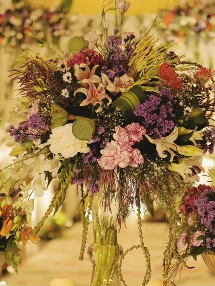 A close-up of the intricate floral centerpiece, showcasing the variety of blooms and textures we use to create our signature lush arrangements.