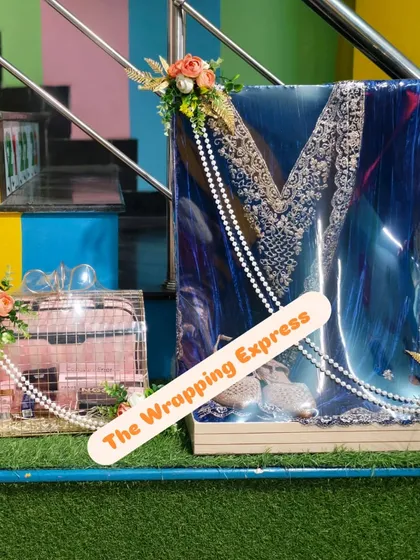 Here is a trousseau packing set for a client. It includes a beautifully wrapped blue velvet suit and a matching decorated gift cage, perfect for presenting wedding gifts.