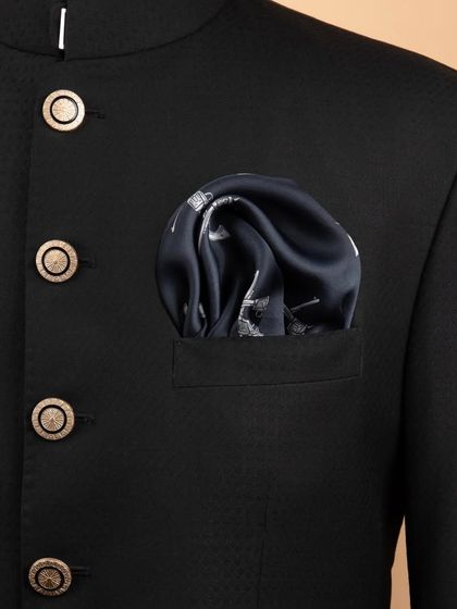 The crossed-pistols pocket square folded and placed in a jacket, demonstrating its stylish, edgy look.