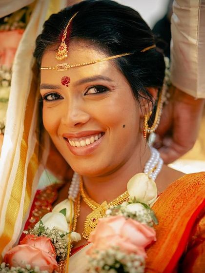 A beautiful close-up of this bride, her smile radiant and her makeup looking subtle and flawless.