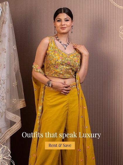 Outfits that speak luxury. This yellow sharara set with intricate floral embroidery is a perfect example of the high-end festive wear you can rent from us.