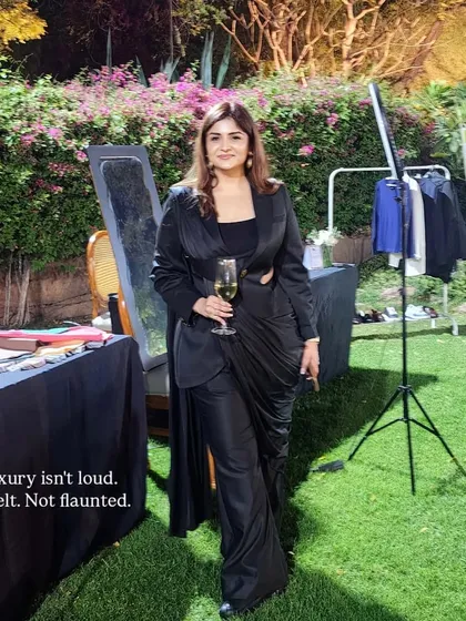 I believe luxury is a feeling, not a label. It's about how you carry yourself and the quiet confidence your style projects. This look, featuring a black cutout power suit, embodies my philosophy of "aspirational distance" where elegance commands attention without demanding it.