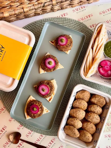My ready-to-cook Galouti Kebabs are perfect for an easy yet impressive appetizer. The image shows the kebabs before and after cooking, served on mini flatbreads with pickled onions and mint chutney.