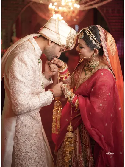 A tender moment between the bride and groom. The groom's gentle kiss on his bride's hand is a classic, romantic shot we love to capture.