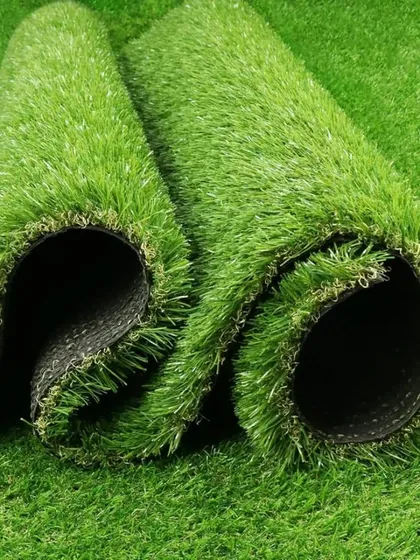 A close-up of a 25mm turf roll, showing the texture and color variation in the blades. This multi-tone approach is what makes the grass look so real.