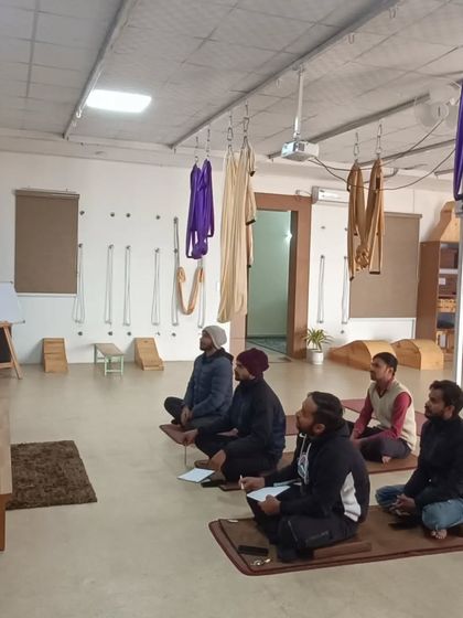 Another view of our well-equipped yoga shala during a workshop. You can see the aerial yoga hammocks and other props that are integral to my therapeutic yoga teacher training.