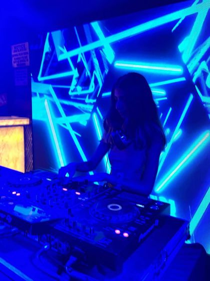 Another angle from my set at QB Lounge Bar, showing the full DJ setup and the cool visual backdrop.