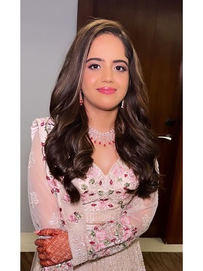 Soft, open waves are a perfect choice for an engagement party. This style is effortlessly glamorous and allows the bride to feel comfortable and beautiful.