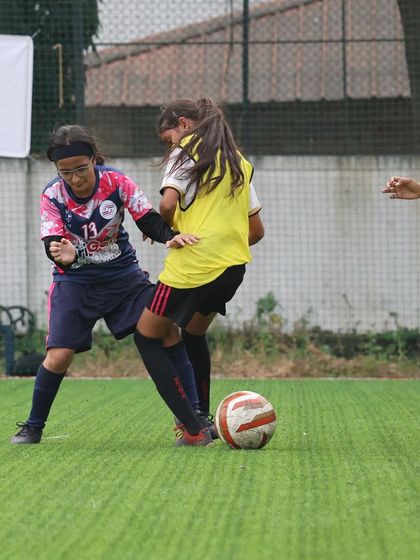 An intense moment from the TGIF x She Kicks Football League, with our player battling for possession of the ball.