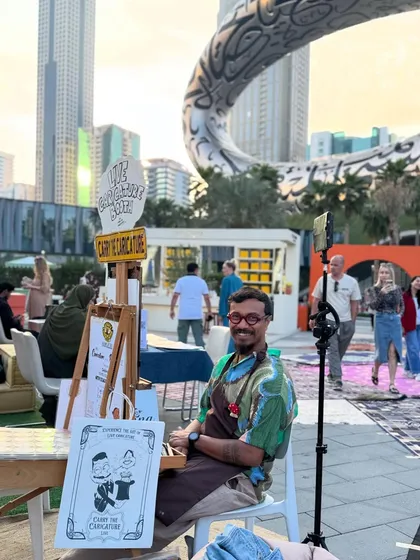 All set up and ready to 'Carry the Caricature' in Dubai. It's a thrill to bring my art to such a dynamic and international city.