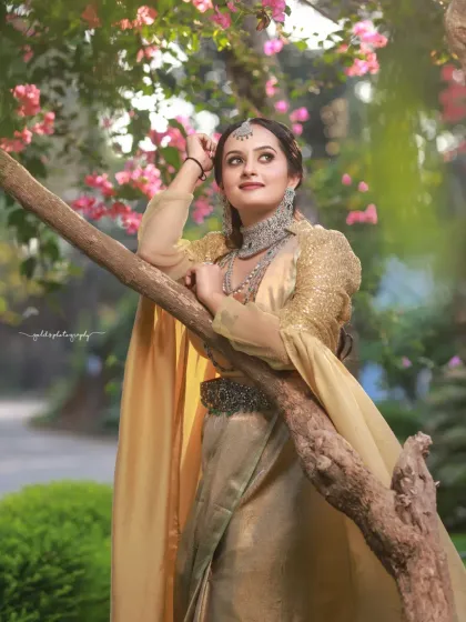 A collection of portraits featuring a model in a golden-hued traditional outfit, shot outdoors. The natural light and garden setting add a soft, ethereal quality to these elegant images.
