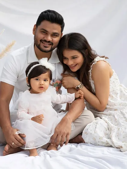 A serene family portrait in all white. This timeless and elegant look creates a feeling of unity and peace, perfect for capturing your family's bond.