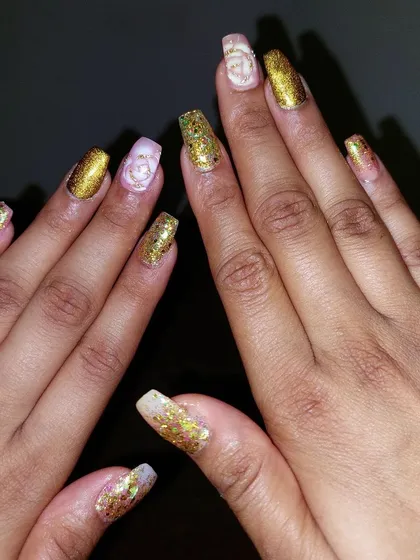 For a touch of glamour, I created this look using gold glitter on long acrylic nails. I also added a delicate 3D rose on the accent nail, a popular choice for engagements, receptions, and other grand celebrations.