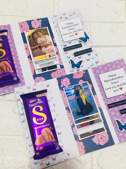A Rakhi card from one sister to another. This waterfall-style card reveals 6 of your favorite photos together and comes with a bar of Dairy Milk Silk chocolate.