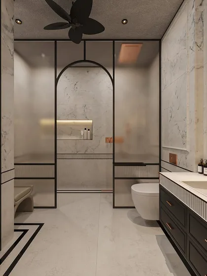 A closer look at the shower and toilet area, showing the frosted glass for privacy and the continuation of the black and white floor pattern.