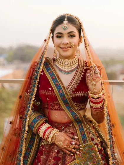 This is the complete royal bridal look. From the flawless makeup and intricate jewelry to the stunning lehenga, every element comes together to create a picture-perfect moment for the bride on her big day.