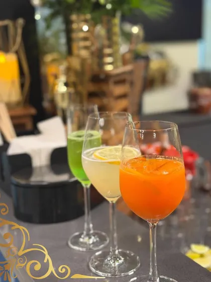 Our bar is where colour and flavour meet. This lineup of signature mocktails, from a zesty carrot and lemon blend to a refreshing green cooler, shows how we craft beautiful, delicious beverages that are a highlight of any celebration.
