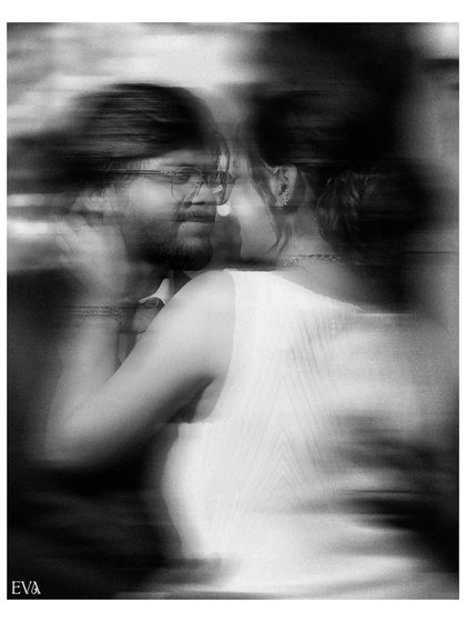 An artistic motion-blur photo in black and white, capturing the dynamic energy and excitement of the engagement day.