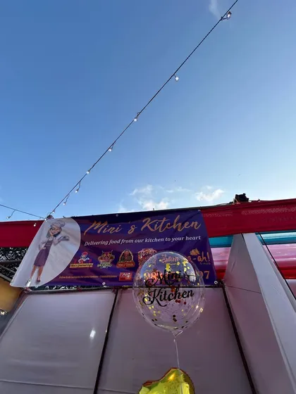 My banner and balloon setup at an outdoor pop-up event. I bring a festive and professional presence to every celebration, big or small.
