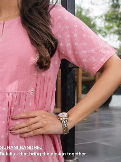 This detail shot of our pink Suhani kurta-dress shows the delicate gathers and short sleeves, designed for a comfortable and flattering fit. Every element is crafted to bring the design together beautifully.