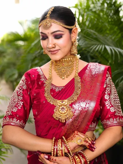 A serene, eyes-closed shot highlighting the beautiful purple and brown smokey eye makeup. This detail adds a touch of modern drama to the otherwise traditional South Indian bridal look.