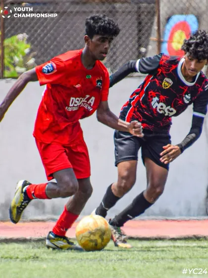 A tense moment from the U17 semi-final, with our player battling for possession.