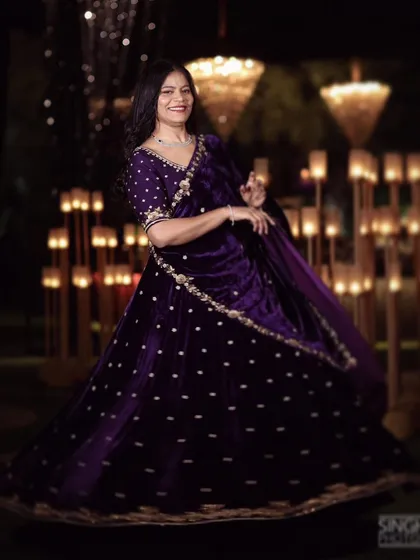For a night of glamour and celebration, this opulent purple velvet lehenga makes a statement. It is hand-embroidered with a dazzling mix of pearls, dabka, and katdana for a truly stellar sangeet or reception look.