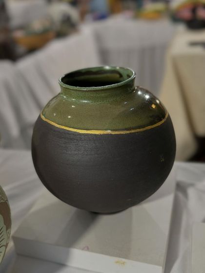 A few of my favorite finished vases from a recent collection, featuring a variety of glazes, painted details, and forms. Each one has its own personality.