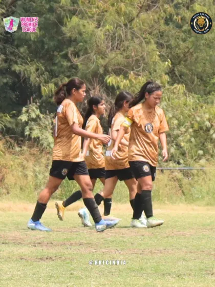 The team walking together on the pitch after a play. This image captures the constant communication and unity within the squad.