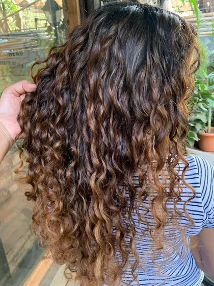 A close-up of the non-bleach ombre on these curly locks. The transition is seamless and natural.