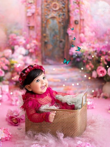 Looking up at the magical butterflies, this baby is completely enchanted during her six-month milestone session.