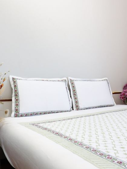 Our classic white bedding set, featuring a beautiful block-printed border in soft, earthy tones. This design offers a fresh, clean look with a touch of traditional Indian craftsmanship.